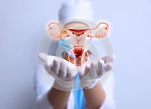 Doctor demonstrating virtual image of infected female reproductive system on light background, closeup. Vaginal candidiasis