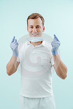 Doctor dentist smiling without medical mask in dental clinic on light background. Smile healthy teeth concept