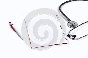 Doctor desk.Stethoscope notebook and pen on white background