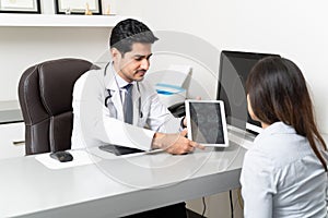Doctor Discussing With Patient Over MRI Scan