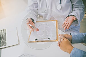 The doctor is discussing with the patient after a physical examination of the results and treatment