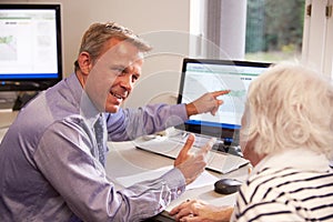 Doctor Discussing Test Results With Senior Female Patient