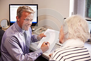 Doctor Discussing Test Results With Senior Female Patient