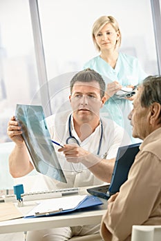 Doctor discussing x-ray image with patient