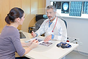 Doctor discussing xray results with patient