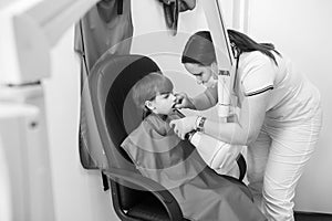 Doctor does an x-ray of the child