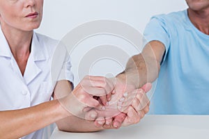 Doctor doing hand massage