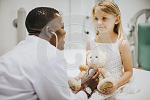 Doctor doing a health checkup on a teddy bear