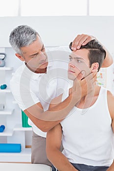 Doctor doing neck adjustment