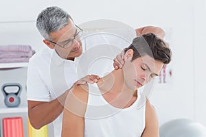 Doctor doing neck adjustment