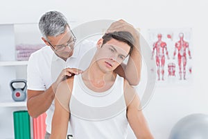 Doctor doing neck adjustment