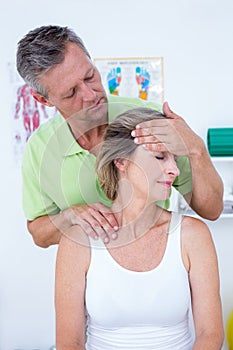 Doctor doing neck adjustment