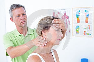 Doctor doing neck adjustment