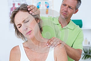 Doctor doing neck adjustment