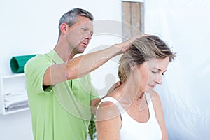 Doctor doing neck adjustment