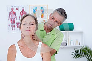 Doctor doing neck adjustment