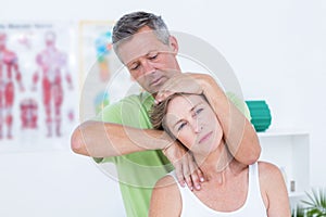 Doctor doing neck adjustment