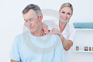 Doctor doing neck adjustment