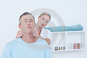 Doctor doing neck adjustment