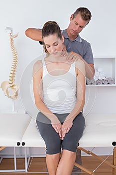 Doctor doing neck adjustment