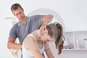 Doctor doing neck adjustment