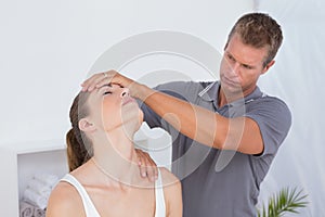 Doctor doing neck adjustment