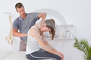 Doctor doing neck adjustment