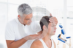Doctor doing neck adjustment