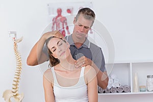 Doctor doing neck adjustment photo