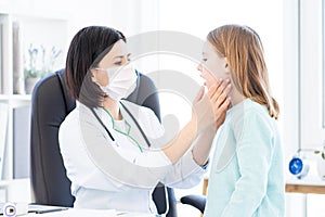 Doctor doing palpation of lymph nodes photo