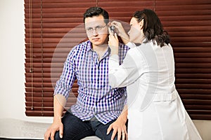 Doctor doing a physical exam to patient