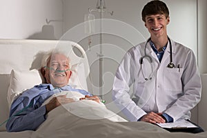 Doctor and elder man smiling