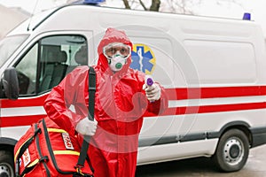 A doctor at an emergency ambulance service car goes to a patient with a suspected novel coronavirus COVID-19 infection