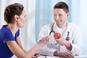 Doctor encouraging patient to health lifestyle