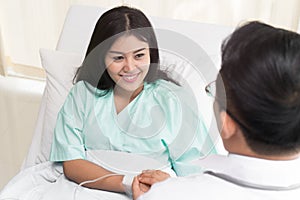 Doctor encouraging patient during treatment therapy.