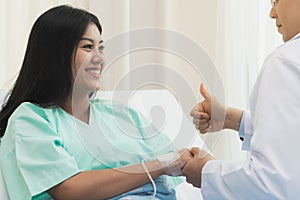 Doctor encouraging patient during treatment therapy.