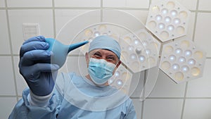 A doctor with an enema in his hands stands above the patient.