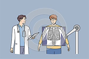 Doctor examine male patient on xray