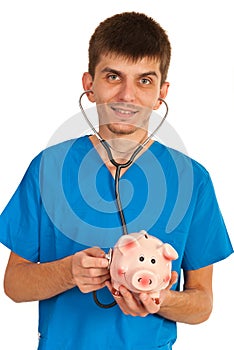 Doctor examine piggybank