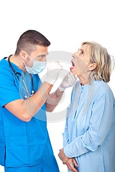 Doctor examine senior throat