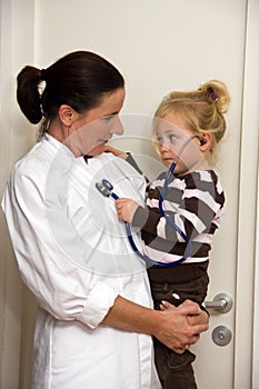 Doctor examines a child in surgery