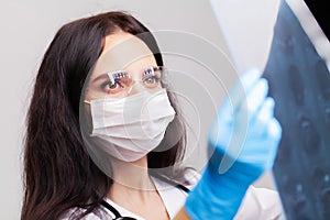 Doctor examines an MRI image of the patient`s brain