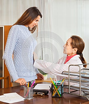 Doctor examining the abdomen the girl