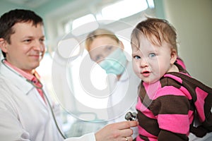 Doctor examining baby