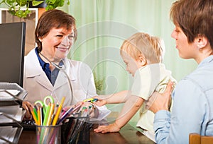 Doctor examining baby