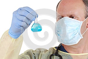 Doctor examining blue laboratory sample