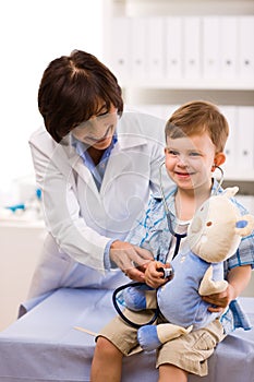 Doctor examining child