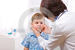 Doctor examining child photo