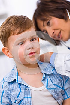 Doctor examining child