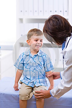 Doctor examining child